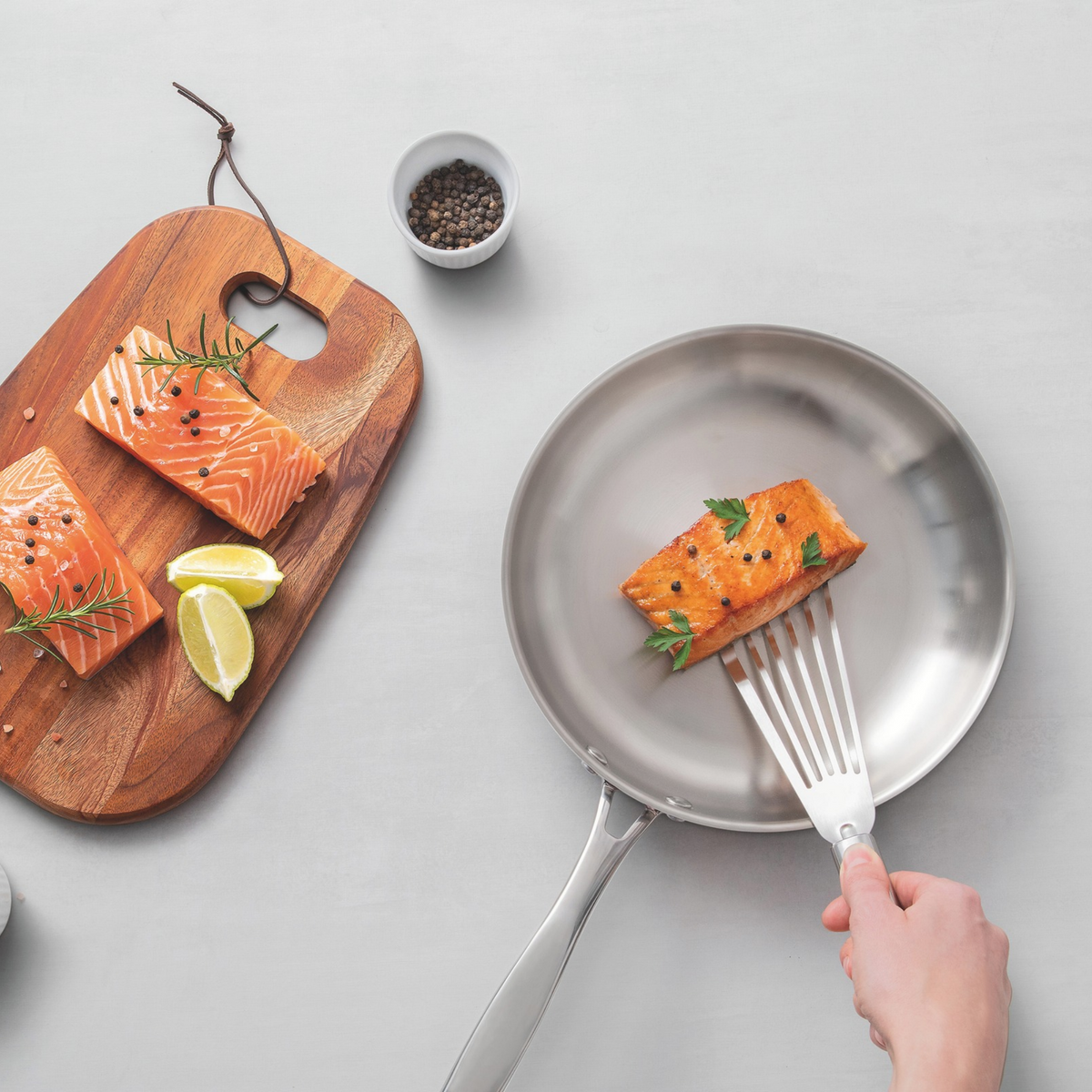 Stainless steel skillet with long handle for induction cooking