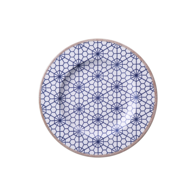 Round porcelain dessert plate, white with blue lattice geometric pattern and tan rim.