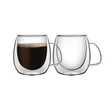 Pair of double-walled tea/coffee cups with curved handles, one filled with dark drink