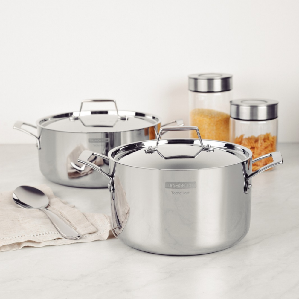 Stainless steel lidded cookware set with three pots and matching lids