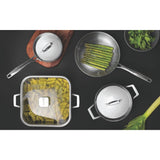 Stainless steel cookware set with multiple pans and lids arranged